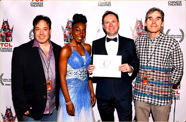 Arek Zasowski wins Best International Romantic Comedy Short — Golden State Film Festival, Hollywood 2020 Arek Zasowski receiving award for Best International Romantic Comedy Short at Golden State Film Festival 2020 at TCL Chinese Theatre, pictured with Jon Grusha, Aemy NiaFeliz, and Peter Greene