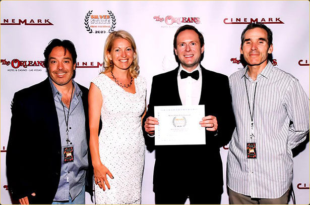 Arek Zasowski wins Best Inspirational Short for Let Go: The Prelude — Silver State Film Festival, Las Vegas 2019 Arek Zasowski holding his award for Best Inspirational Short at the Silver State Film Festival for Let Go: The Prelude, on the red carpet in Las Vegas with Viola Zasowska, Jon Grusha, and Peter Greene