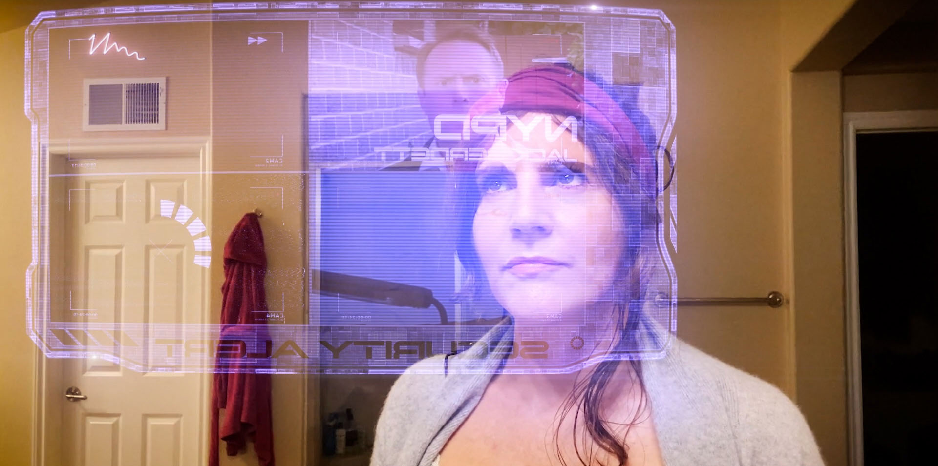 Arek Zasowski and Lizet Benrey monitoring holographic surveillance data in Detective Jack Berdett