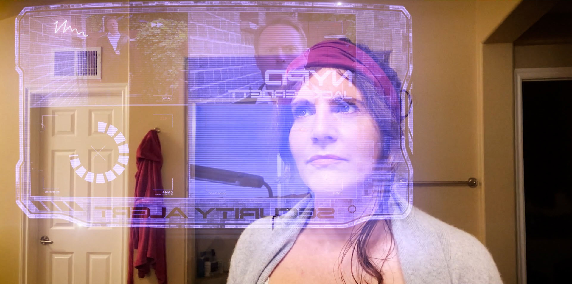Hologram screen alarm scene with Lizet Benrey, and Arek Zasowski