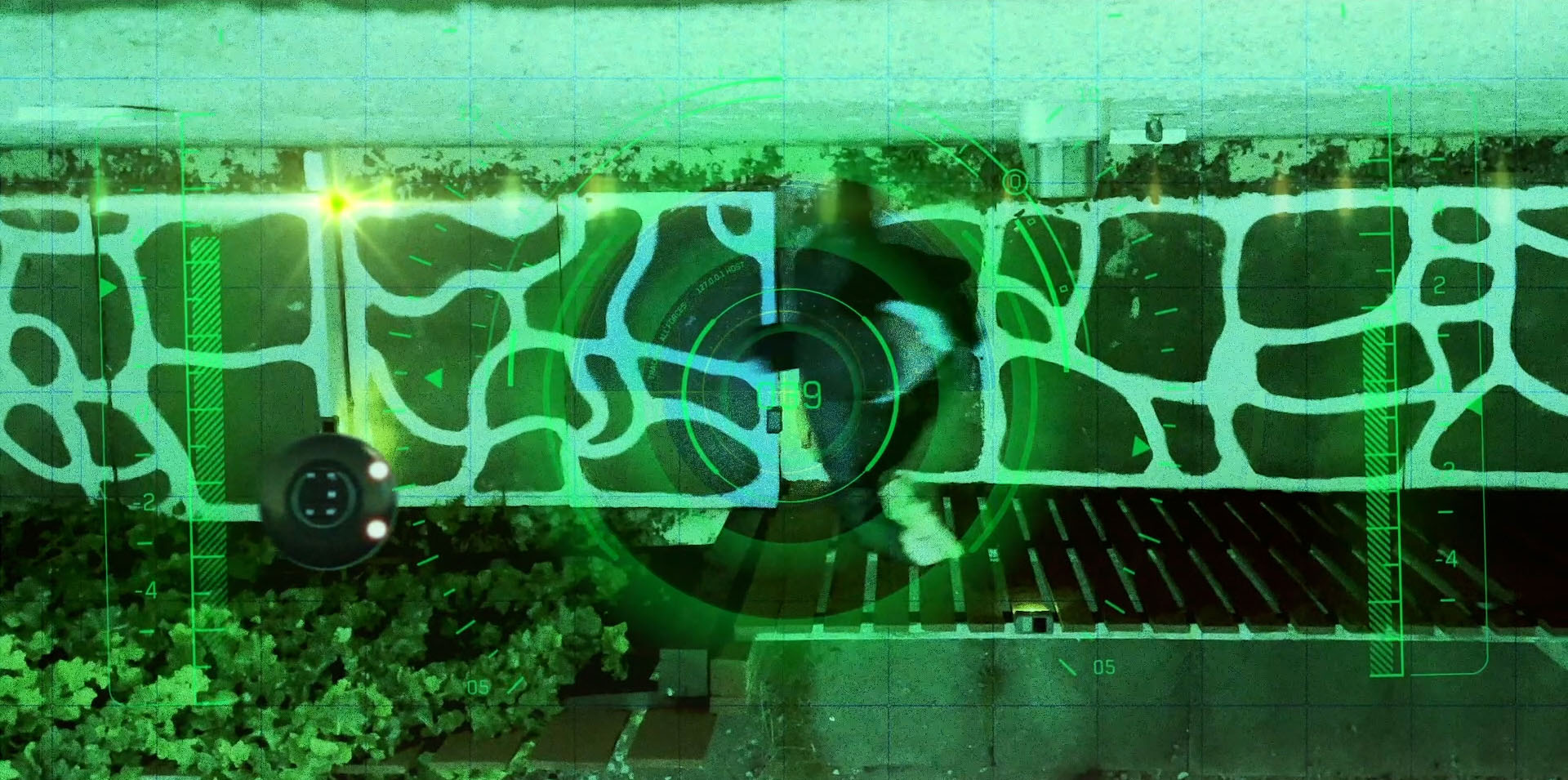 Aerial drone surveillance feed tracking the suspect in Detective Jack Berdett